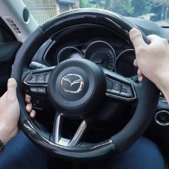 Bọc Vô Lăng Ô Tô Vân Carbon Đính Logo Hãng Xe, Chống Trượt, Không Mùi, Tôn Vẻ Sang Trọng Nội Thất